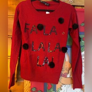 Red Sweater with Black Pom Poms